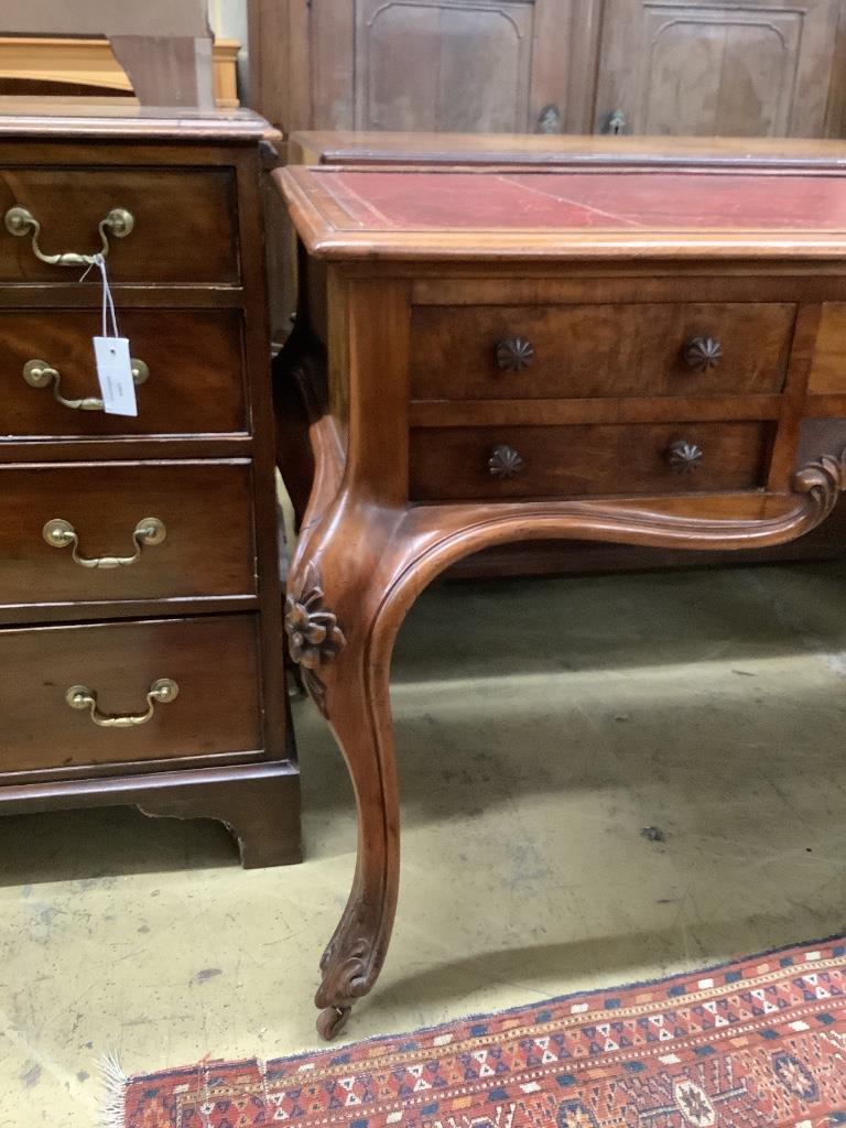 A Victorian walnut kneehole rosewood desk by Wilkinson & Son, Old Bond Street, stamped 11761, width 134cm, depth 64cm, height 75cm